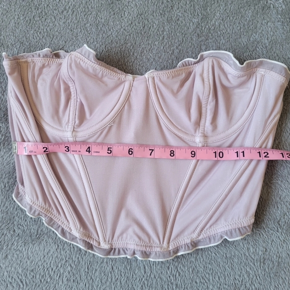 out from under pastel pink and white corset top - Picture 3 of 4